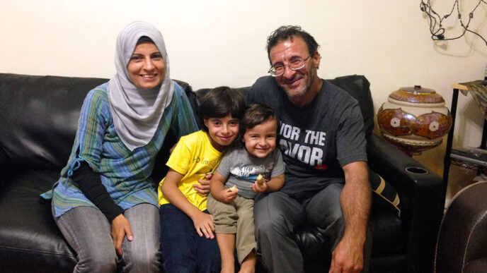 Fatima Adris with her husband Fadi and sons Abdel Hamid (left) and Osama|Suzanne Akras Sahloul of the Syrian Community Network.