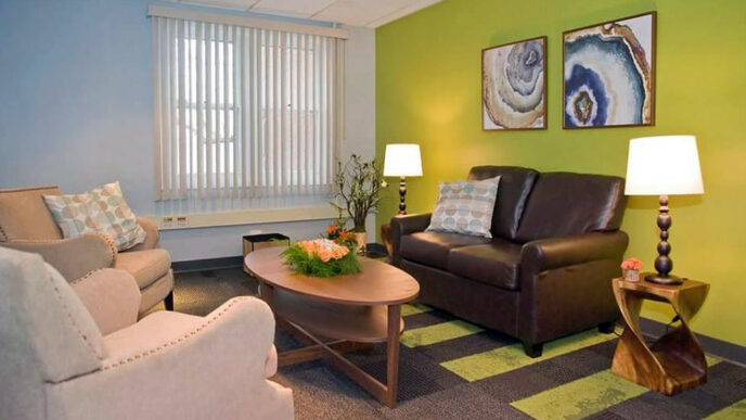 A comfortable interior space with green and blue walls.
